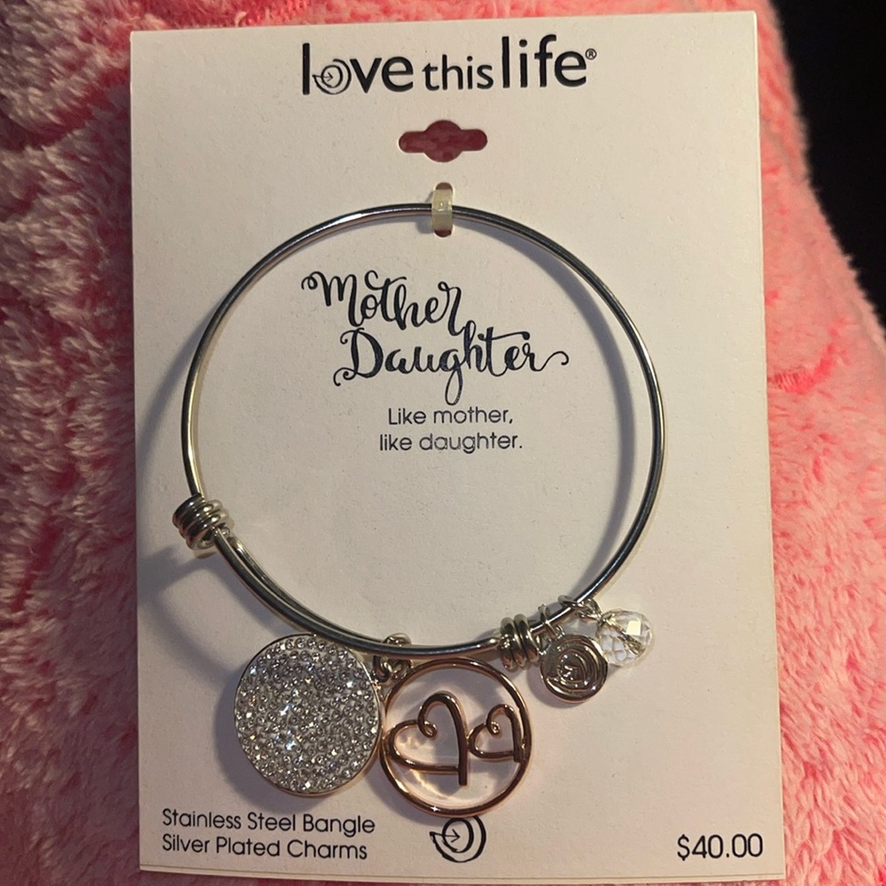 NWT:  stainless steel bangle, silver plated charms